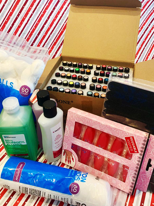 Image of nail care supplies including polish, files, cotton balls, and alcohol.