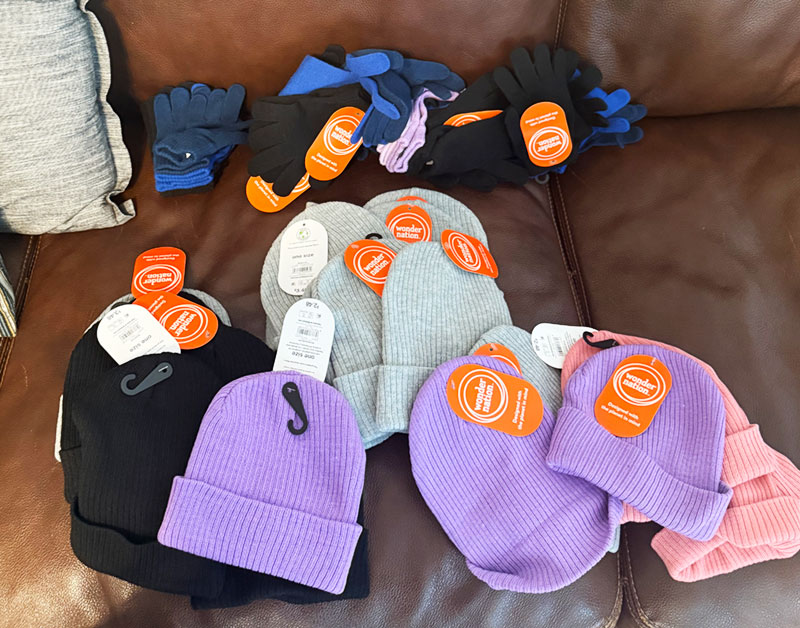 Knit caps and gloves of varying sizes and colors 